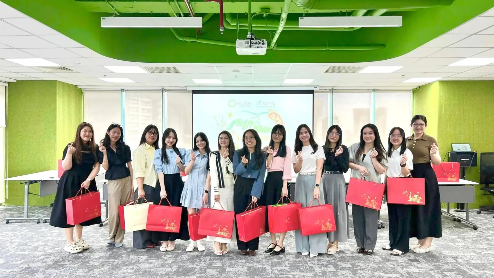 terra team members with gifts at a company celebration